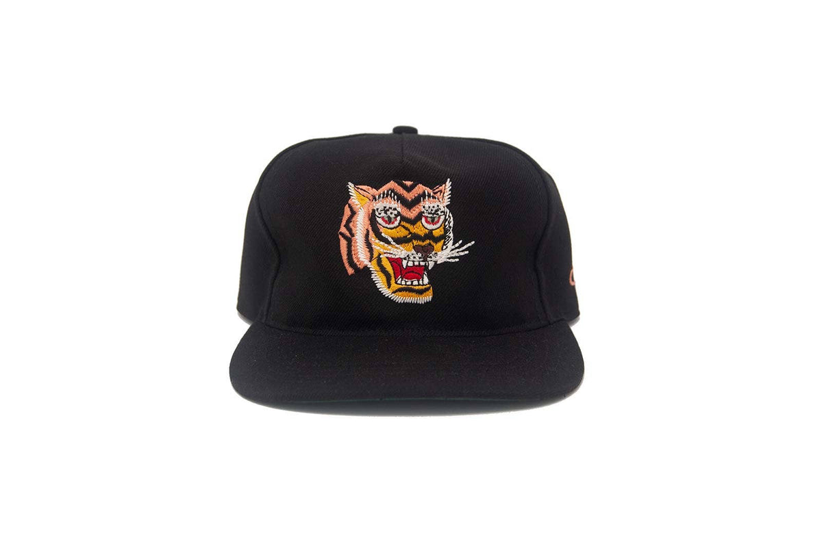 Black cap with a tiger logo on a white background