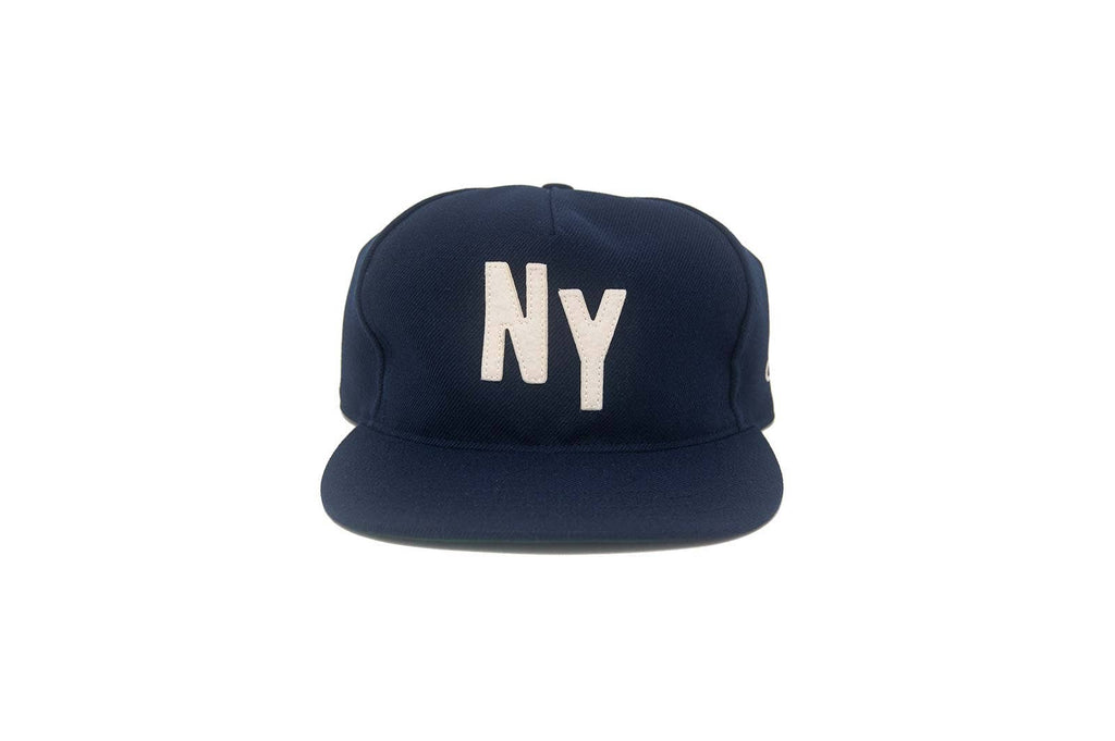 Navy blue cap with 'NY' on a white background