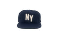 Navy blue cap with 'NY' on a white background