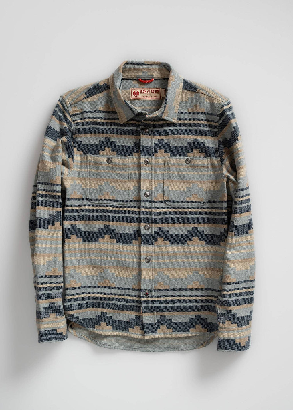 Flannel shirt with geometric pattern on a white background