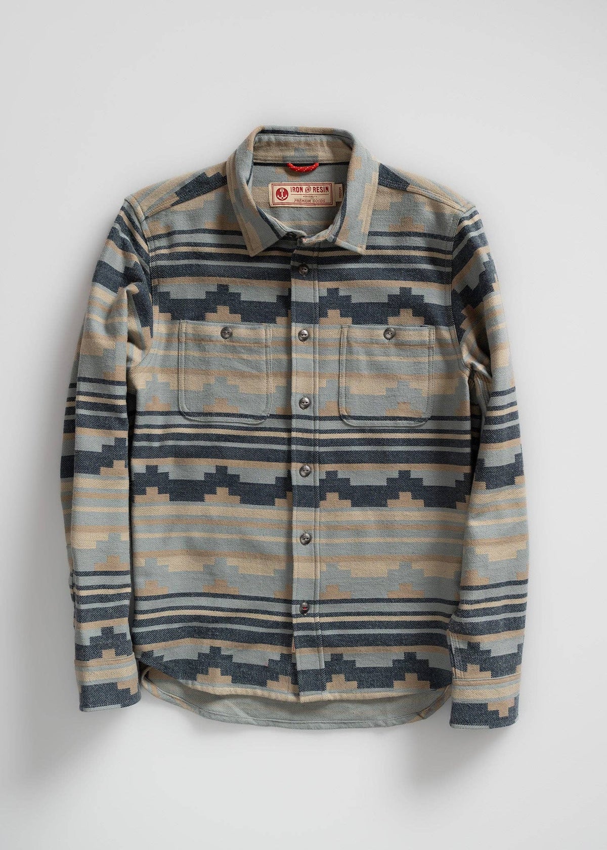 Flannel shirt with geometric pattern on a white background