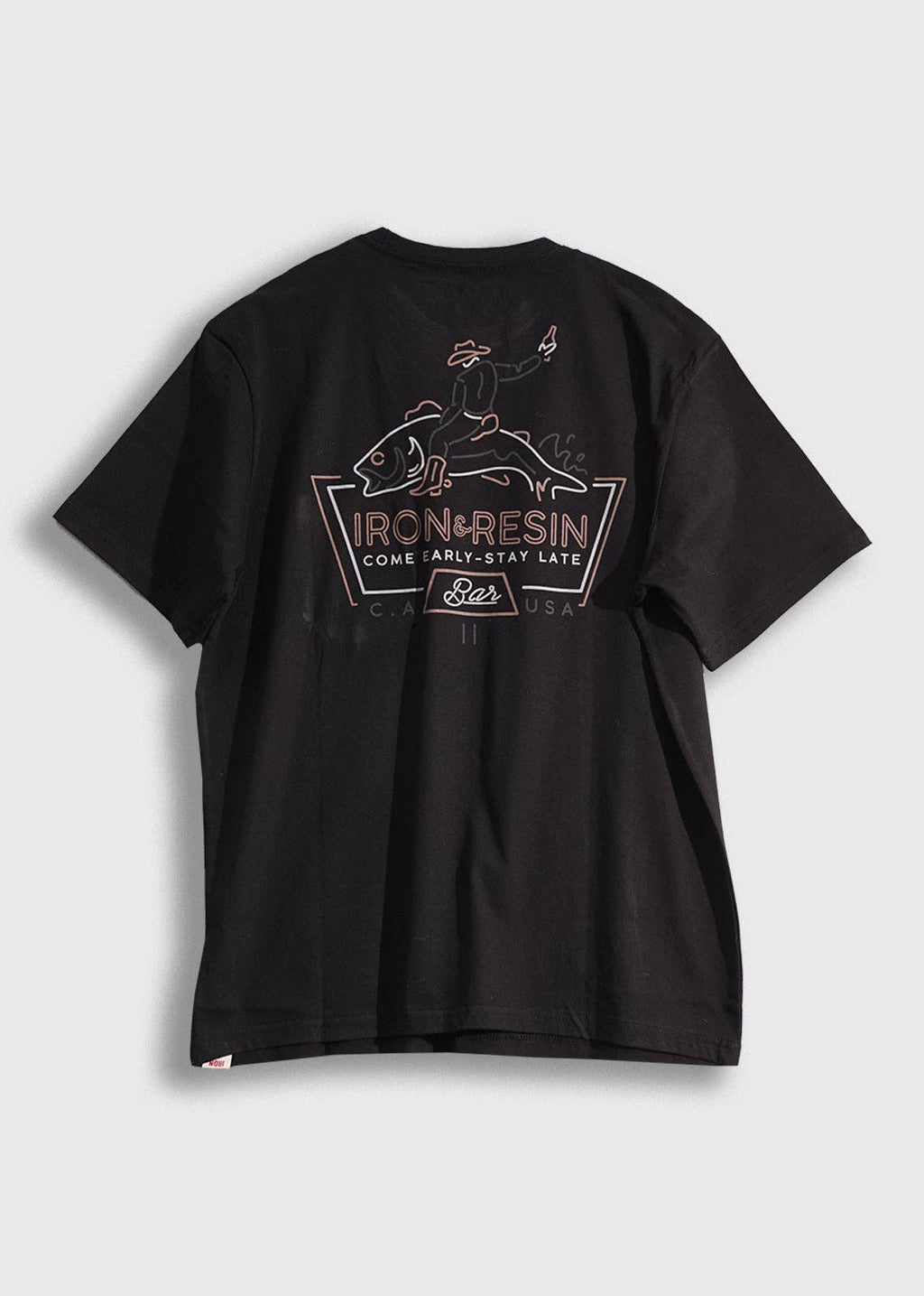 Black t-shirt with a graphic design on the back against a light gray background