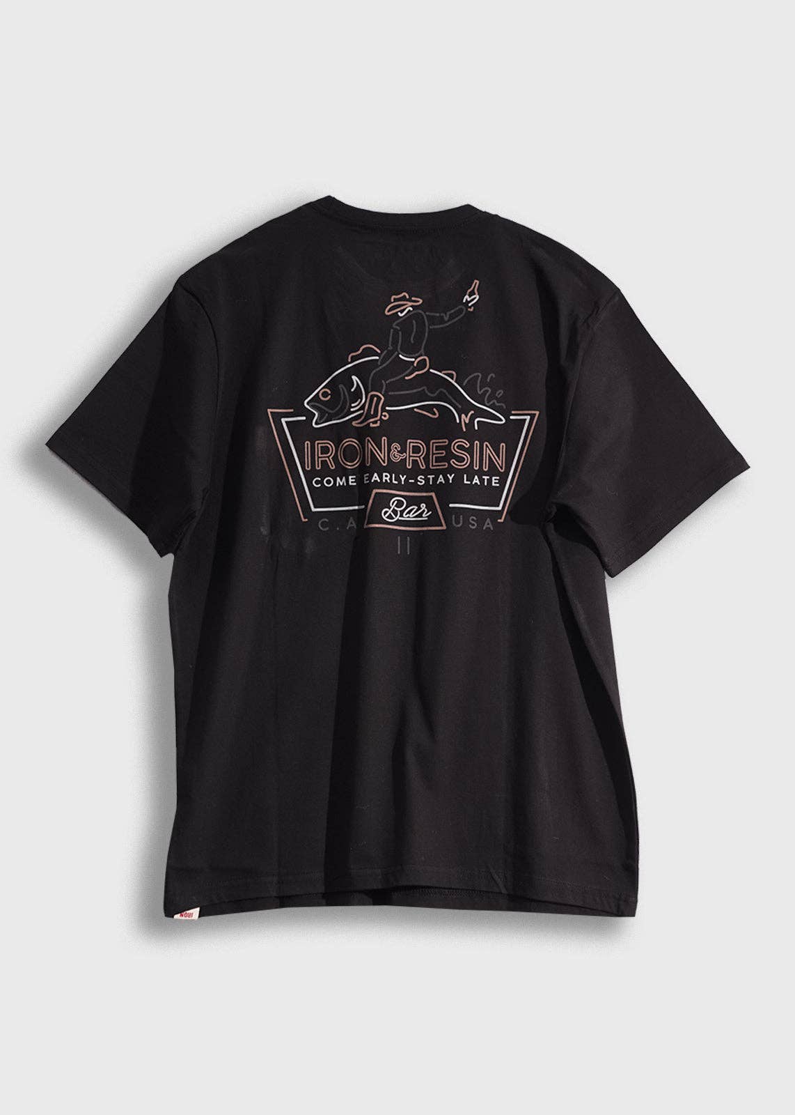 Black t-shirt with a graphic design on the back against a light gray background