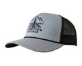 A light gray heather trucker hat with black mesh back panels and a black embroidered logo on the front that reads 'JUNCTION & BENCH' with a mountain and bridge graphic.