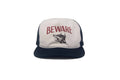 Trucker hat with 'BEWARE' text and wolf graphic on a white background