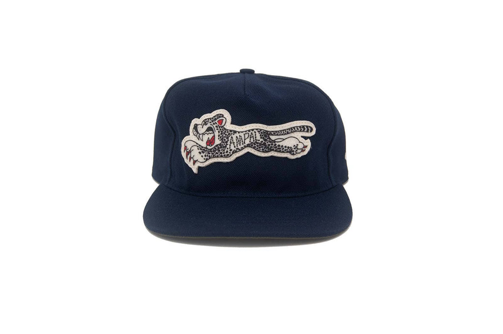 Navy blue cap with a embroidered tiger design on a white background