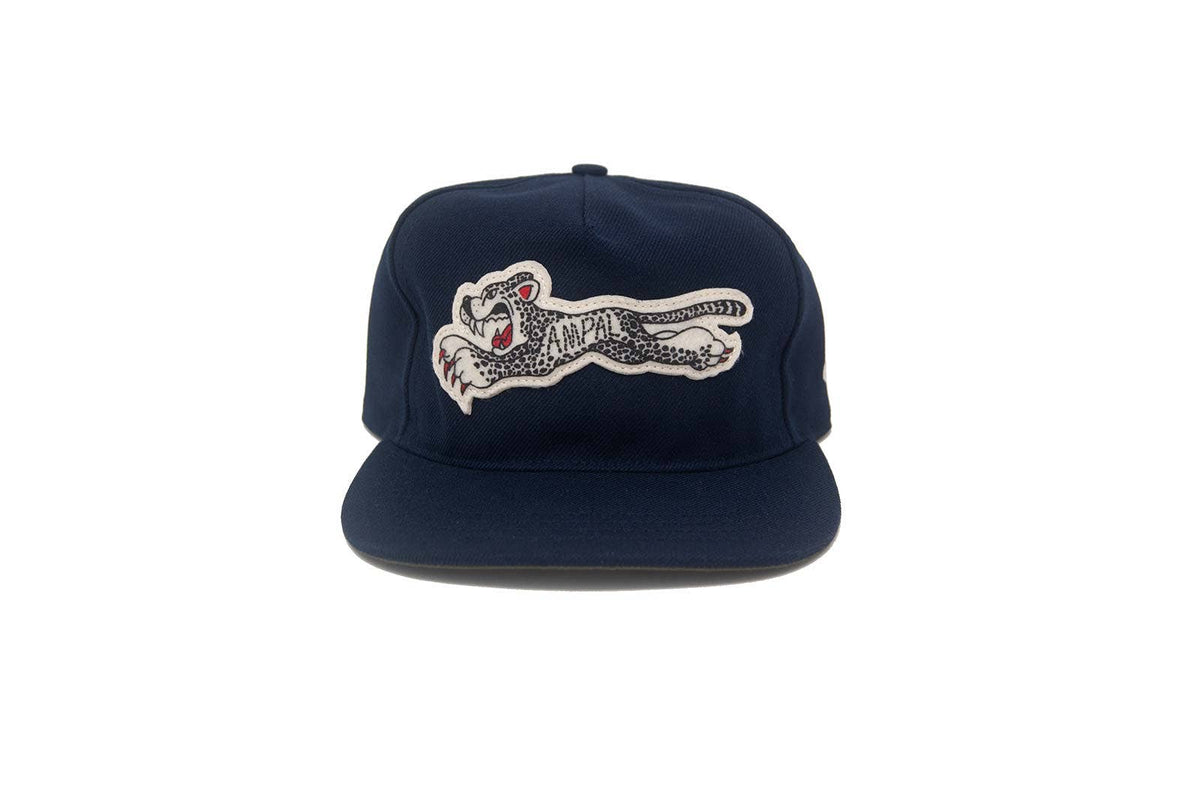 Navy blue cap with a embroidered tiger design on a white background