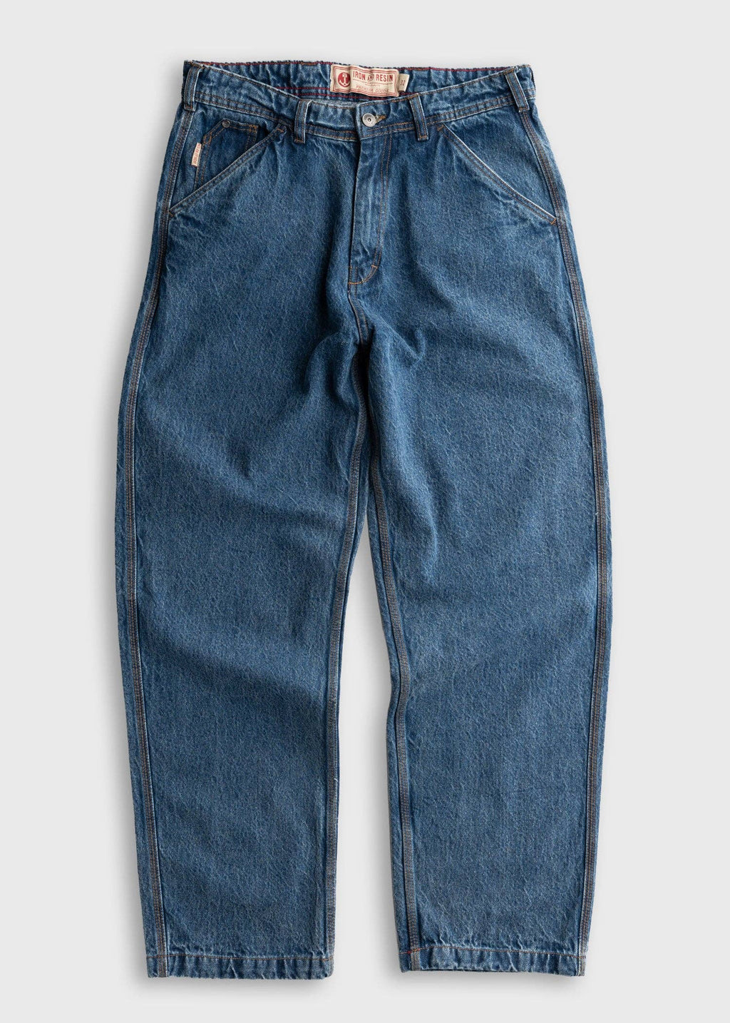 A pair of medium-wash blue denim jeans with a relaxed, straight-leg fit, laid flat against a light gray background.