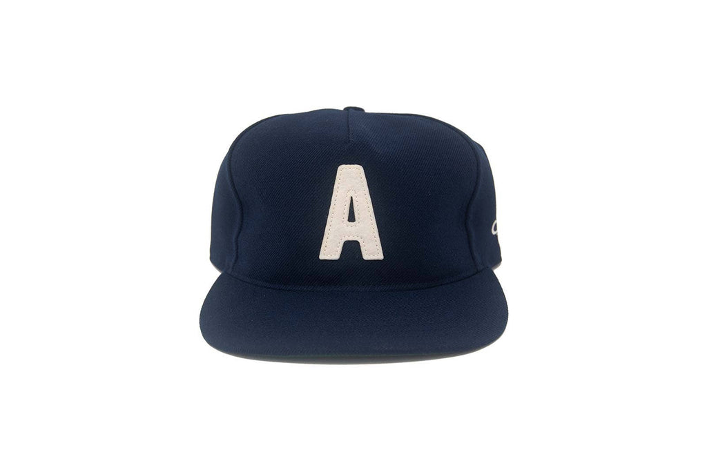 Navy blue cap with a white letter 'A' on a white background