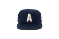 Navy blue cap with a white letter 'A' on a white background