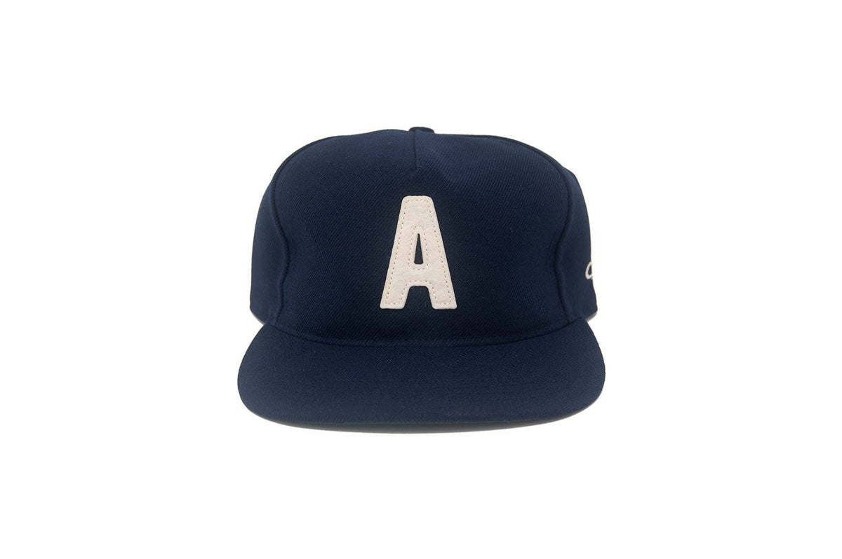 Navy blue cap with a white letter 'A' on a white background
