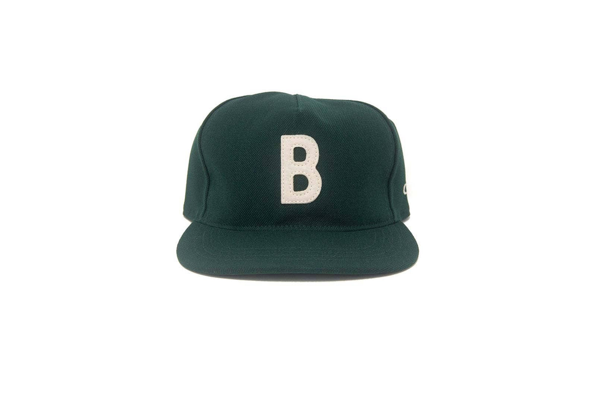 Vintage B on a foest green cap
