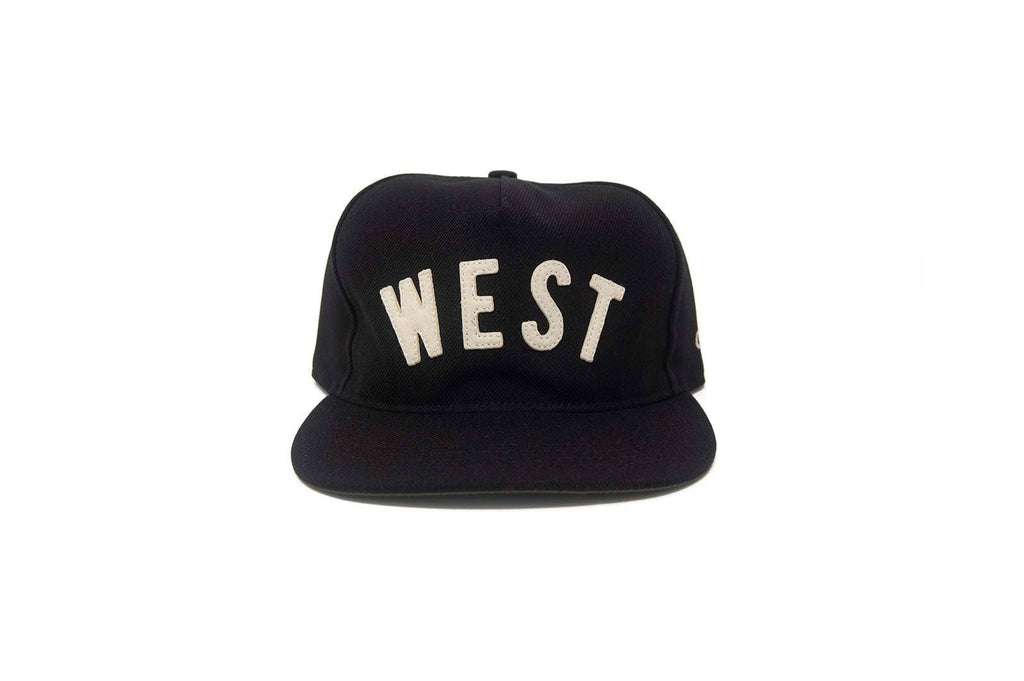 Black cap with 'WEST' printed on it against a white background