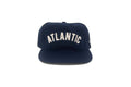 Navy blue cap with 'Atlantic' text on a white background