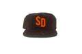 Brown cap with orange 'SD' logo on a white background