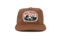 Brown cap with 'Wild Horses' patch on a white background