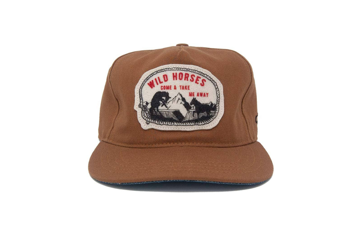 Brown cap with 'Wild Horses' patch on a white background