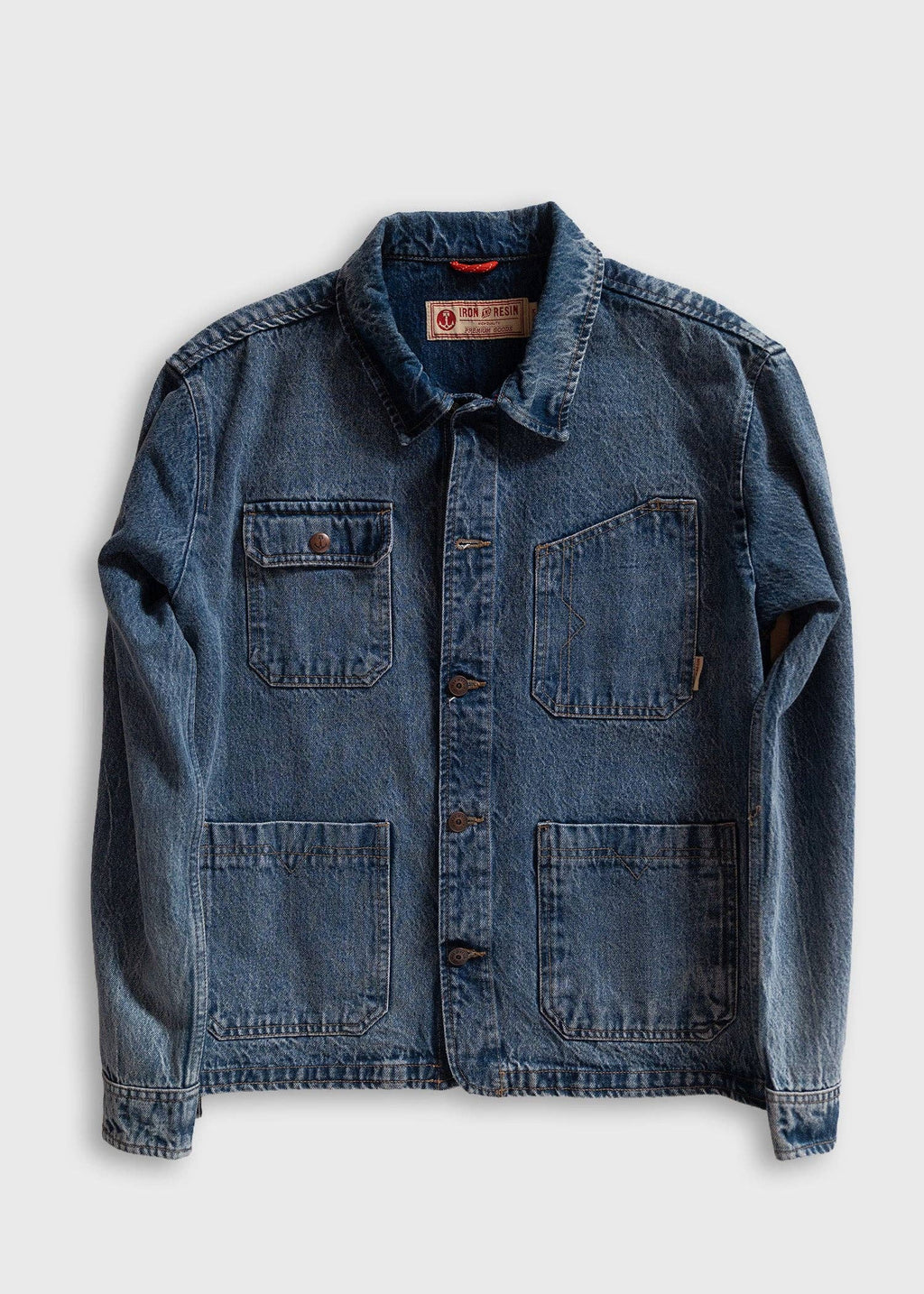 Blue denim jacket on a light gray background