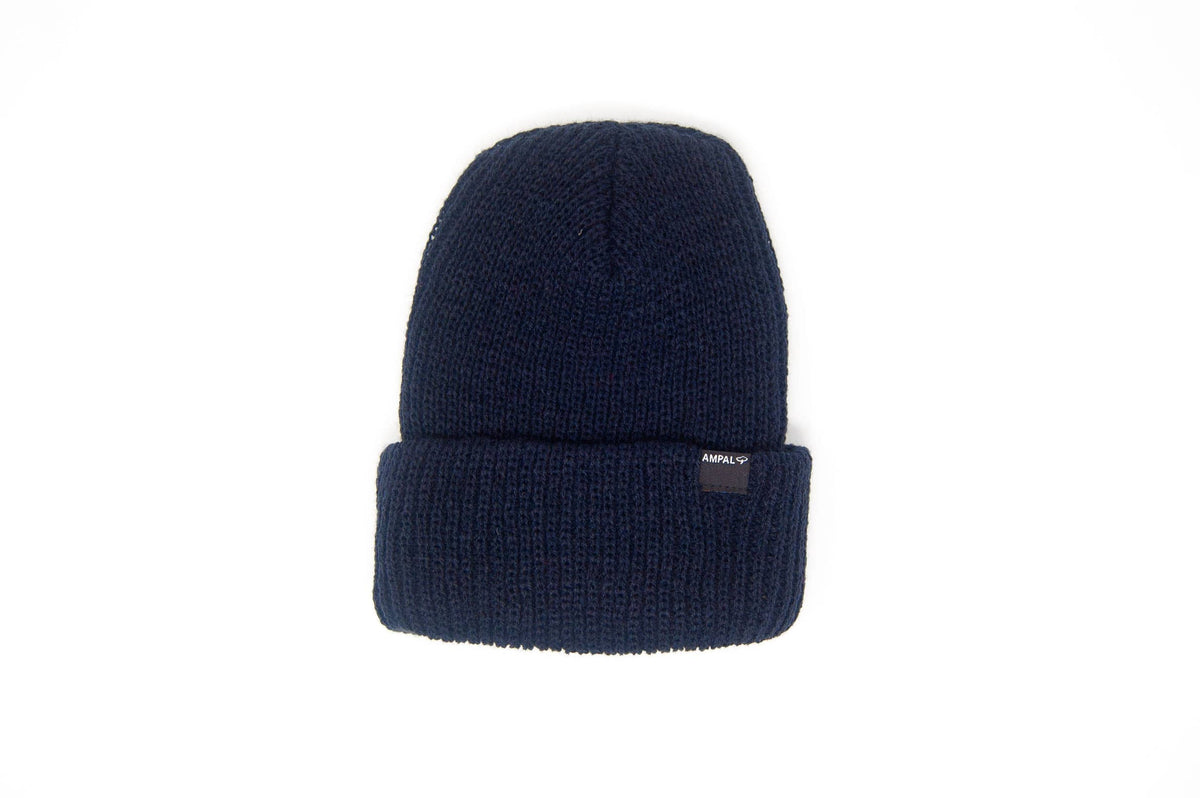 A dark navy blue ribbed knit beanie hat with a folded cuff, featuring a small black brand tag on the side, set against a plain white background.