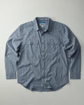 Blue button-up shirt with a collar on a light gray background