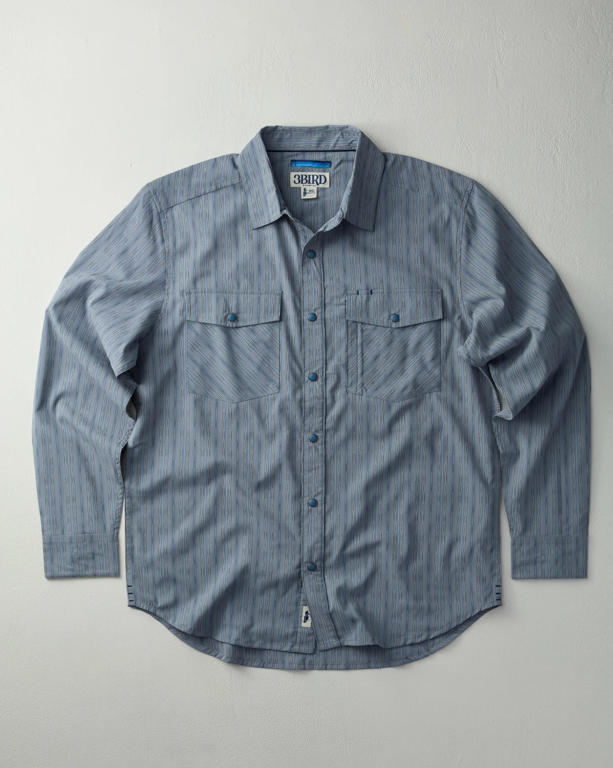 Blue button-up shirt with a collar on a light gray background