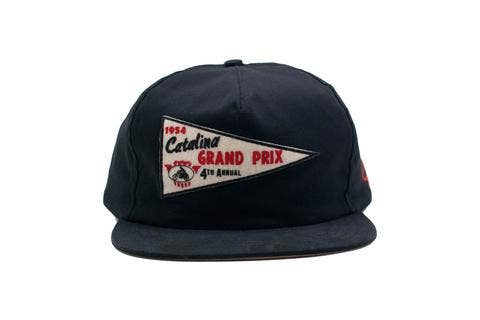 Black cap with a vintage-style pennant logo on a white background