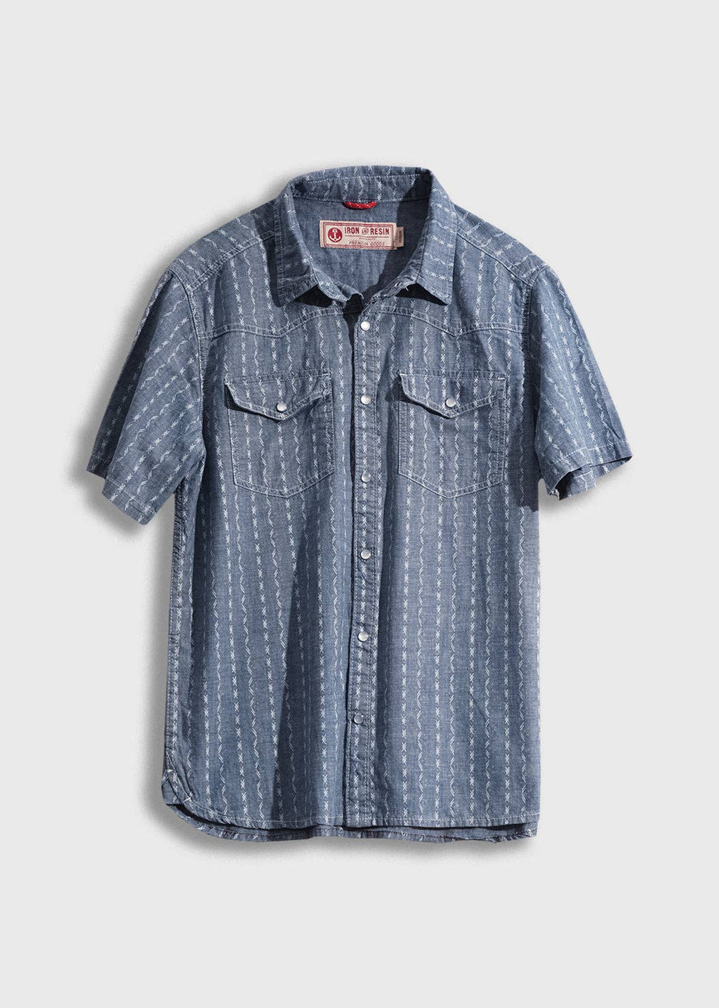 Blue patterned shirt on a light gray background