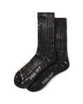 A pair of black crew socks with a distressed, faded beige pattern and the brand name 'STEEL CITY' printed in white on the toes, shown on a plain white background.