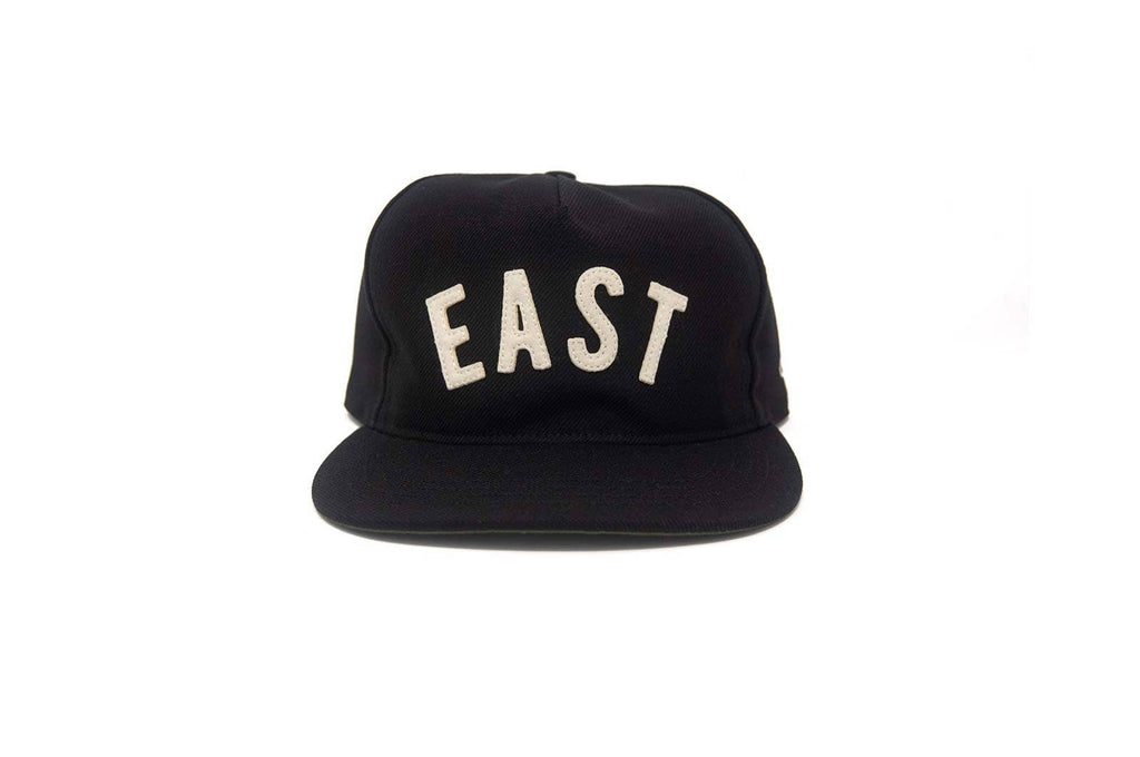 Black cap with 'EAST' printed on it against a white background