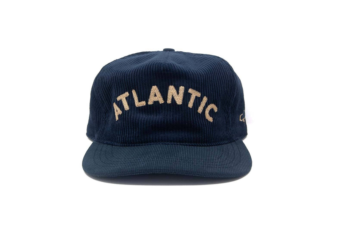 Navy blue cap with 'Atlantic' text on a white background